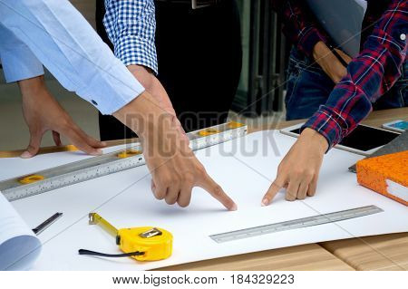 Architects who work with blueprints inspecting workplace engineers for architectural planning drafting construction projects