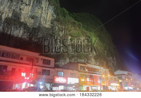YANGSHOU CHINA - NOVEMBER 19, 2016: Yangshou town night cityscape and karst mountain.