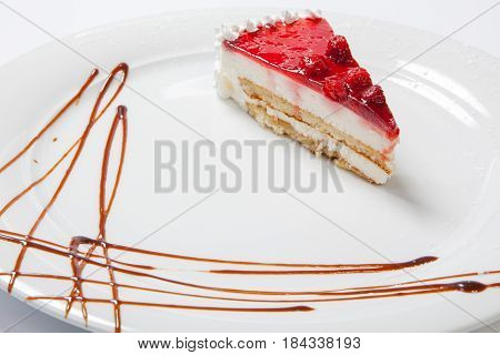 Dessert - Cheesecake With Berries Sauce On White Plate