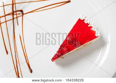 Dessert - Cheesecake With Berries Sauce On White Plate