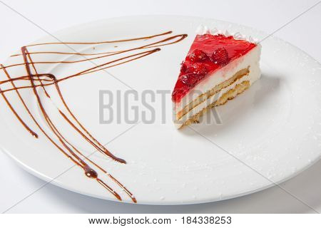 Dessert - Cheesecake With Berries Sauce On White Plate