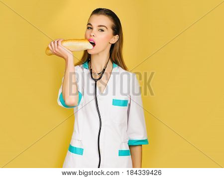 Pretty Nurse Woman Or Doctor Eating Baton
