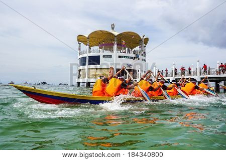 Labuan,Malaysia-April 29,2017:Group of boatman with life jacket participate in a boat tug of war games in Labuan International Sea Sports Complex at Labuan,Malaysia on 29th April 2017.