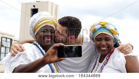 Tourist taking a selfie with tradicional Brazilian Women - Baianas