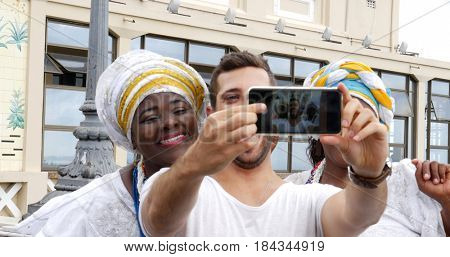 Tourist taking a selfie with tradicional Brazilian Women - Baianas