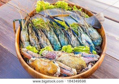 Raw Seafood set ready to cook on wooden table