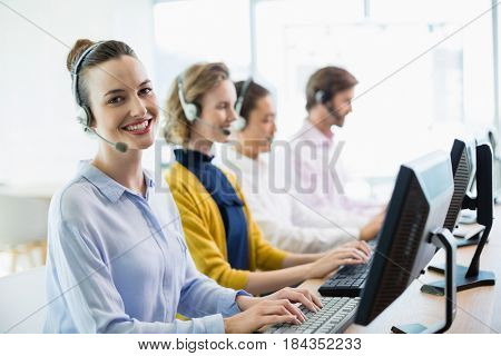 Team of customer service executives working in call center