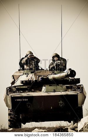 France the training center of the foreign legion - circa 2011. Legionnaires of the 1st Cavalry Regiment of French Foreign Legion on AMX-10 tank during exercises.