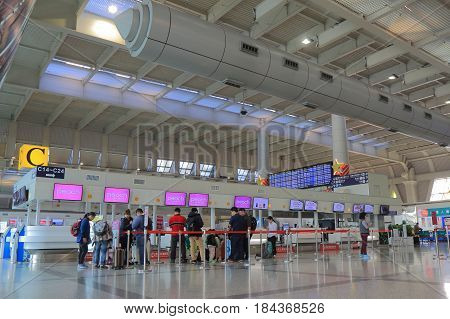 KAOHSIUNG TAIWAN - DECEMBER 16, 2016: Unidentified people check in at Peach air check in counter at Kaohsiung international airport.