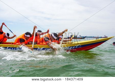 Labuan,Malaysia-April 29,2017:Group of boatman with life jacket participate in a boat tug of war games in Labuan International Sea Sports Complex at Labuan,Malaysia on 29th April 2017.