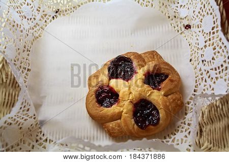 Close up fresh home made puffs with berry jam