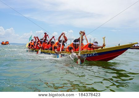 Labuan,Malaysia-April 29,2017:Group of boatman with life jacket participate in a boat tug of war games in Labuan International Sea Sports Complex at Labuan,Malaysia on 29th April 2017.