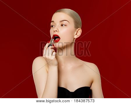 Fashion Photo. Closeup Of Woman Face With Bright Red Matte Lipstick On Full Lips. Beauty Cosmetics,
