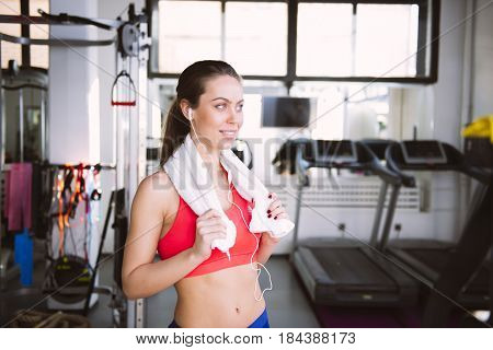 Pretty Young Woman Relaxing In The Gym