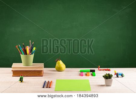 Back to school concepty with clear blackboard background, desk, items