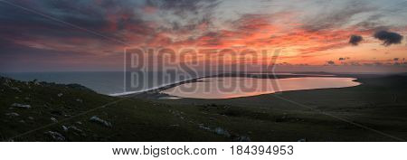 Sunset over the sea and lakes. Opuk. Crimea. Russia