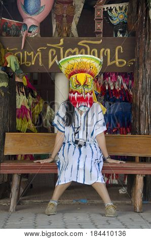 Asian Thai Woman Wearing Mask Head With Costume Of Phi Ta Khon Dance And Playing At Phi Ta Khon Muse