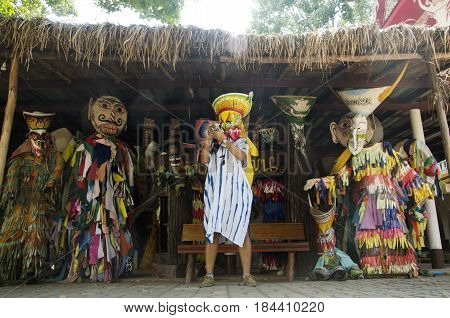 Asian Thai Woman Wearing Mask Head With Costume Of Phi Ta Khon Dance And Playing At Phi Ta Khon Muse
