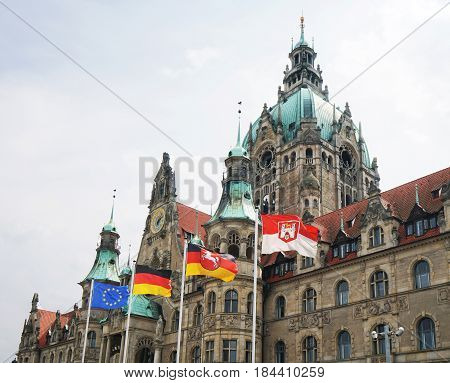 New Town Hall in Hannover, Germany, with flags of Europe, Germany, Lower Saxony and Hannover city