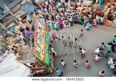 KOLKATA WEST BENGAL INDIA - 12TH AUGUST 2012 : Religious Hindu devoteed pulling ropes of procession Lord Ram. Ram is a Hindu God based on whose life epic story "Ramayana" was written thousand of years ago.