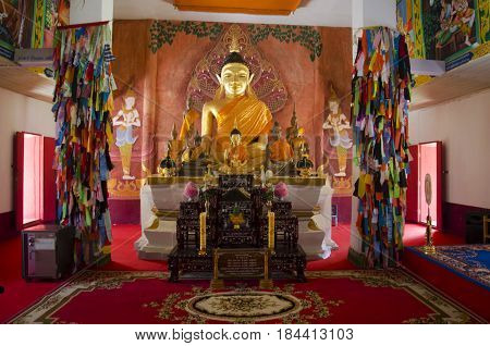Golden Buddha Statue In Ubosot For People And Travellers Praying At Wat Phon Chai