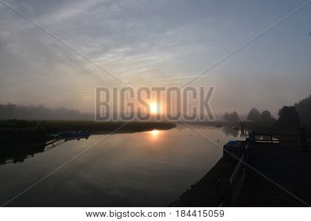 Beautiful Duxbury bay at sunrise on a foggy morning.