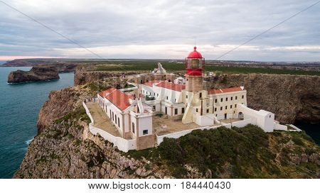 View of the lighthouse and cliffs at Cape St. Vincent at sunset. Continental Europe's most South-western point, Sagres, Algarve, Portugal.