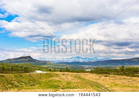 Landscape with mountains and clouds in Rondane, Norway