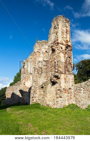 Old Castle ruins in Europe. Episcopal palace from fourteenth century in Bodzentyn, Poland with green grass, trees and blue sky.
Photo taken on: September 23rd, 2014