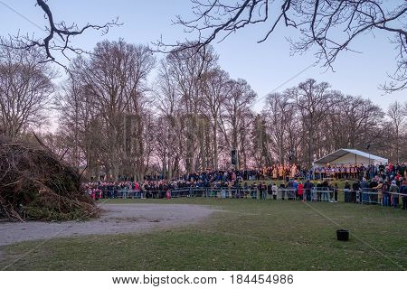 NORRKOPING, SWEDEN - APRIL 30, 2017: Traditional Swedish celebration of spring at Walpurgis night with bonfire and music at Folkparken in Norrkoping. The festival is named after Saint Walpurga.
