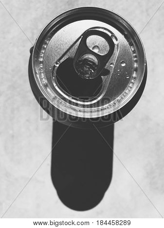 Can of soda with shadow. Monochrome photo in retro vintage style
