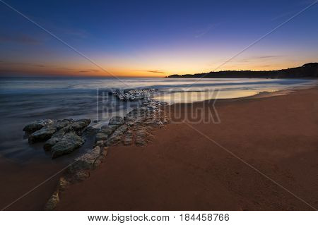 View of the Vau Beach (Praia do Vau) at sunset in Portimao Algarve Portugal; Concept for travel in Portugal and Algarve