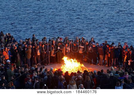STOCKHOLM SWEDEN - APR 30 2017: Celebrating the spring with the Valborg bonfire at Riddarholmen in the evening April 30 2017 in Stockholm Sweden
