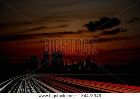 Illustration of lighttrails at night. City in background.