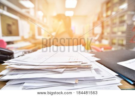 stack documents pace on desk in office