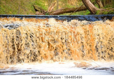 Small waterfall on Sablinka River in Leningrad Region Russia.