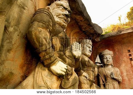 Yuantouzhu - Taihu scenery garden, Wuxi, China APRIL 2017 : Big stone Buddha on the stone wall