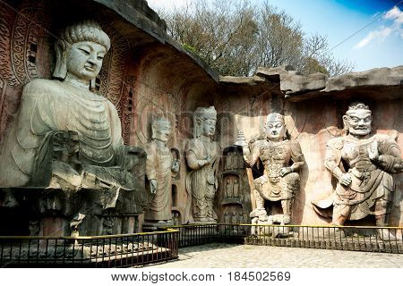 Yuantouzhu - Taihu scenery garden, Wuxi, China APRIL 2017 : Big stone Buddha on the stone wall