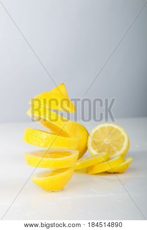 Flying Lemon. Sliced Lemon On White Background. Levity Fruit Floating In The Air.