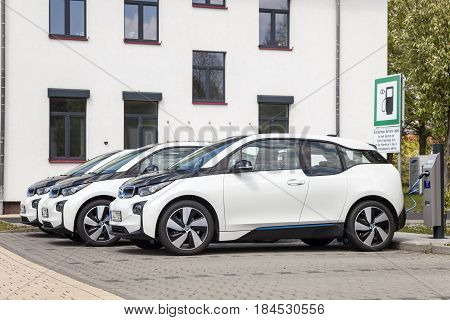 Frankfurt Germany - March 30 2017: Three BMW i3 electric vehicles at a charging station