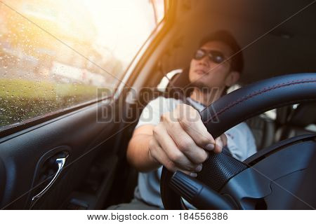 Asian Man Male Ware Sun Glass Drive A Car.