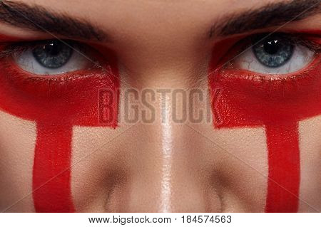Beauty Women's Eyes and red Paint Make-up Stripes on Face