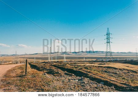 Electric Power Transmission Pylon On Inner Mongolia Grassland Against Blue Sky  ,china