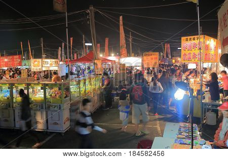 TAINAN TAIWAN - DECEMBER 11, 2016: Unidentified people visit Tainan flower night market. Tainan flower night market is the biggest night market in Tainan.