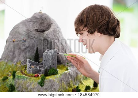 School Student Working On Model Building Project