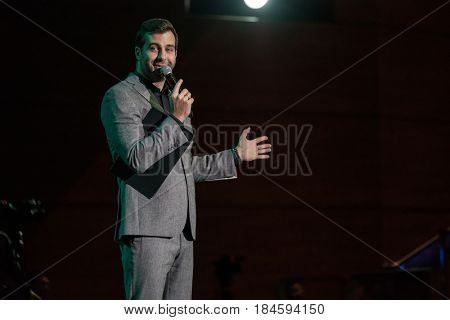 Moscow, Russia - April 24, 2017: Famous Russian showman Ivan Urgant performs at Synergy Global Forum at Crocus Expo Hall. This is one of the largest business forums with more than 5000 participants