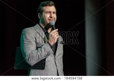 Moscow, Russia - April 24, 2017: Famous Russian showman Ivan Urgant performs at Synergy Global Forum at Crocus Expo Hall. This is one of the largest business forums with more than 5000 participants