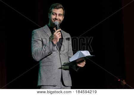Moscow, Russia - April 24, 2017: Famous Russian showman Ivan Urgant performs at Synergy Global Forum at Crocus Expo Hall. This is one of the largest business forums with more than 5000 participants