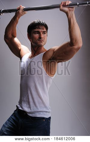 The sexy warrior is flexing his muscles