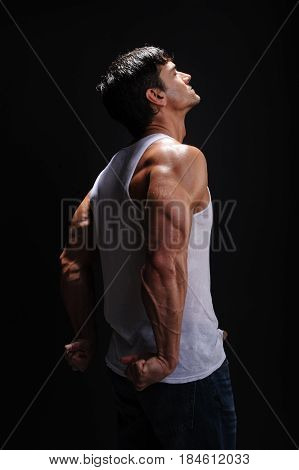 The buff warrior is flexing his triceps.